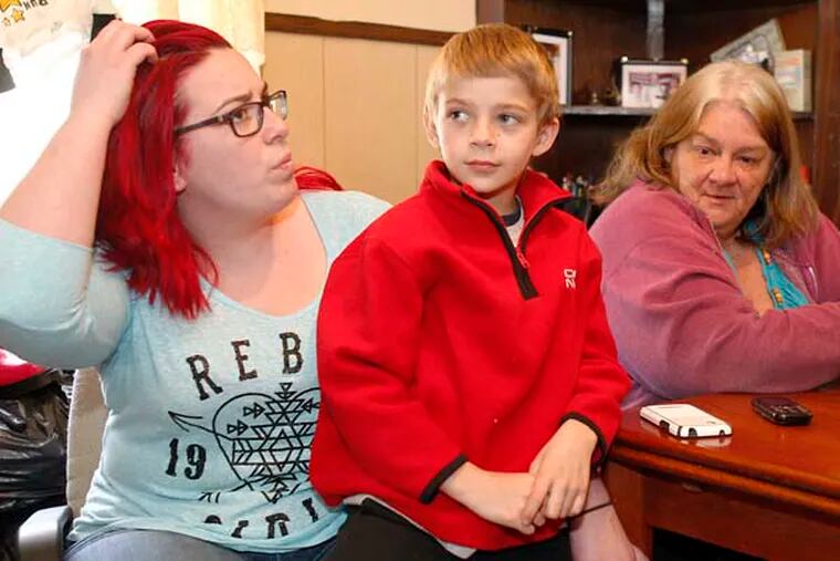 "We've been poisoned!" said Shirley Johnston, (right), as she sat at a table in her modest Greenwich Avenue home next to Andrea McFarland (left) and 8-year-old Nathan Exler (center). "What about all the kids who live around here?"