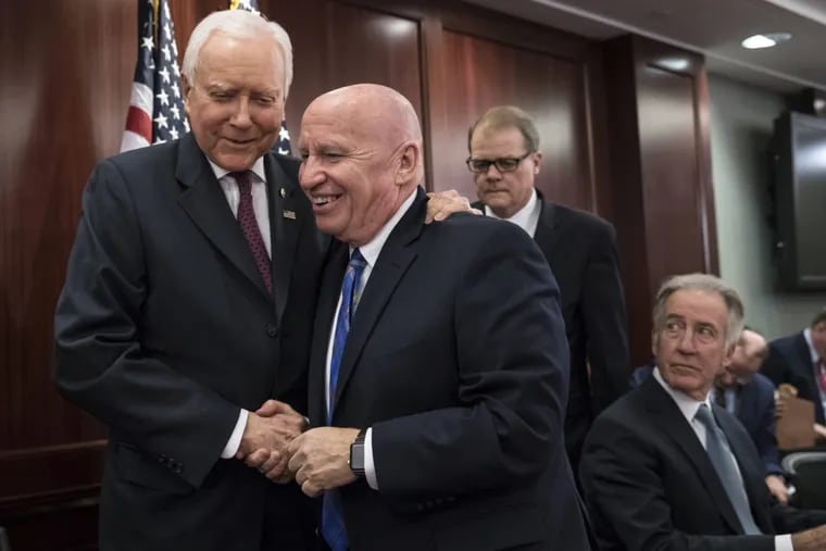 House Ways and Means Committee Chairman Kevin Brady (R., Texas) center, embraces Senate Finance Committee Chairman Orrin Hatch (R., Utah), left, as House and Senate conferees after GOP leaders announced they have forged an agreement on a sweeping overhaul of the nation's tax laws, in Washington, Dec. 13. Rep. Richard Neal (D., Mass.) ranking member of the House Ways and Means Committee, looks on at far right.