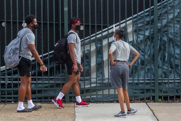 Football players gathering outside Temple's football practice facility on Aug. 14.