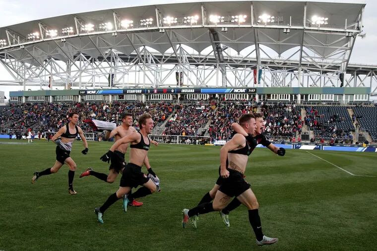 Stanford’s Sam Werner, second from right, celebrates his game winning goal as Stanford University defeats Indiana University in overtime to win the 2017 NCAA men’s soccer national championship game at Talen Energy Stadium.