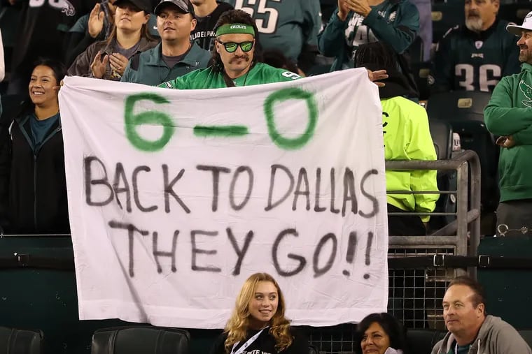 A fan holds up a handmade sign during the Eagles' 26-17 win over the Cowboys at Lincoln Financial Field on Oct. 16.