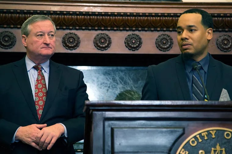 Jack Drummond (right) speaks at a news conference where he was announced as the new director of the Office of Black Male Engagement at City Hall. Mayor Kenney (left) and Drummond say they hope to integrate more elements from President Obama's my Brother's Keeper initiative in the city.