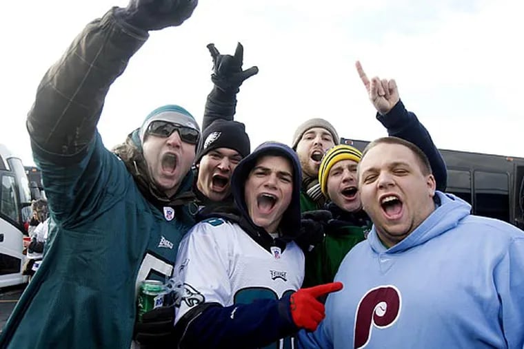 Eagles fans tailgating outside Giants Stadium pose for a photo. From left to right: Dan Hirsch, of Phoenixville, Kevin Ecker, of Cinnaminson, Rick Spadaro, of Paoli, Sean Riley, of Ridley Park, Steve Welsh, of Cinniminson, and Zach Geouque, of Collegeville. (Ed Hille/Staff Photographer)