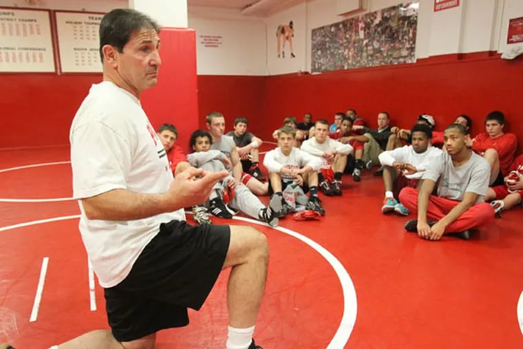Paulsboro wrestling coach Paul Morina talks to his wrestling team during a practice. (Charles Fox/Staff Photographer)