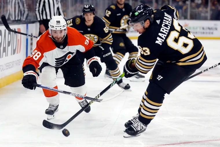 Flyers defenseman Victor Mete playing against the Boston Bruins' Brad Marchand during the preseason.
