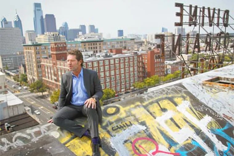 Eric Blumenfeld, president of EB Realty Management Corporation,  looks at the skyline from the roof of the Divine Lorraine Hotel. The developer is attempting to buy the property. August 24, 2012. ( MICHAEL S. WIRTZ / Staff Photographer )