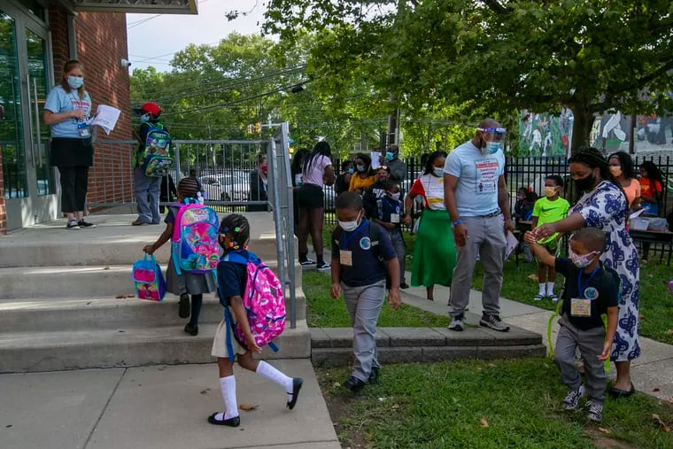 Students entering the Discovery Charter School in Philadelphia on Aug. 31. The school was one of the few public schools in the city to reopen in-person this fall.