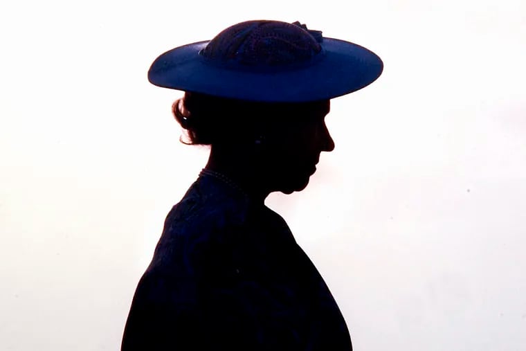 Britain's Queen Elizabeth II silhouetted during welcoming ceremonies at the airport in Barbados in March 1989.