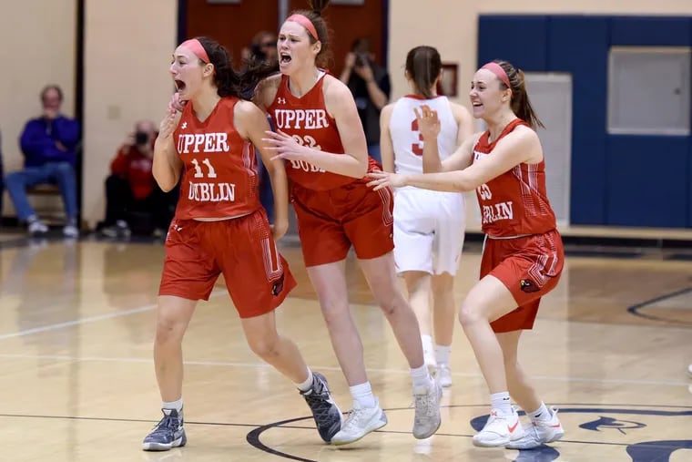Upper Dublin players (from left) Nicole Kaiser, Kara Grebe and Maggie Weglos celebrate as they win, 26-25, over Souderton in the girls state class 6A semi-final game at Council Rock South, March 19, 2018. TOM GRALISH / Staff Photographer