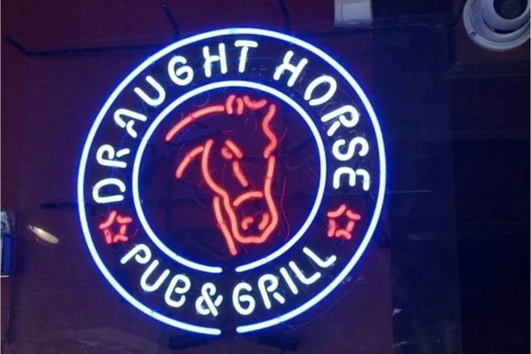 A neon sign is among the Draught Horse auction items.