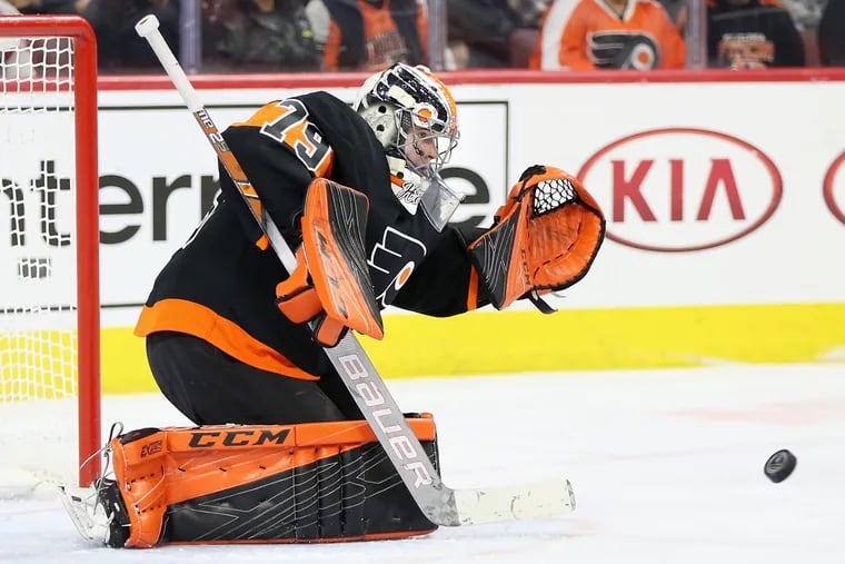 Flyers' Carter Hart (79) blocks a shot during a game against the New York Islanders at the Wells Fargo Center in South Philadelphia on Saturday, March 23, 2019.