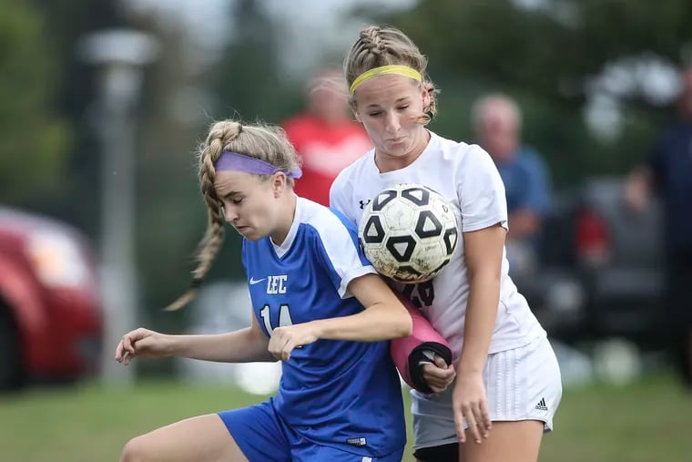 Little Flower's Maura Kilkenny tries for the loose ball with Conwell-Egan's Alexandra Chalmers during the first half in Fairless Hills, Pa., Thursday October 4, 2018. STEVEN M. FALK / Staff Photographer
