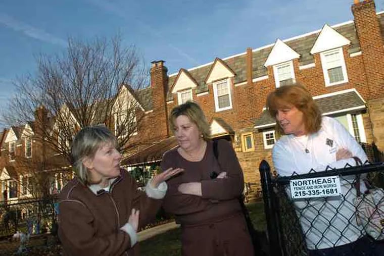 Neighbors (from left) Kathy Brzycki, Jacqueline Morrison and Pam Ewing discuss the shooting death of neighbor Christopher Donaghy, who lived in the next block of Bleigh Avenue in the Holmesburg section of the city.