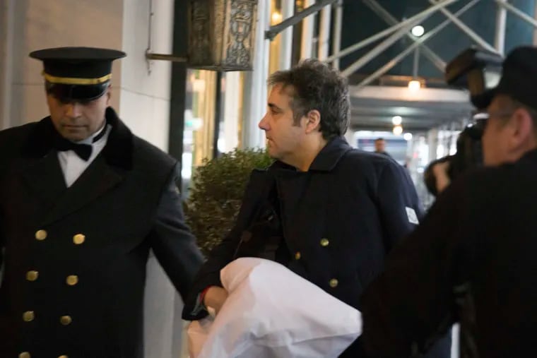 FILE - In this Jan. 18, 2019, file photo, Michael Cohen arrives at his home in New York with his left arm in a sling supported by a pillow.