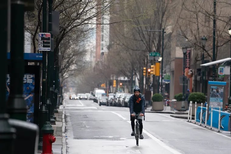 A cyclist on the 1600 block of Chestnut Street in Center City Philadelphia, an area where the city has tried to reduce traffic congestion through changes in loading and parking regulations.