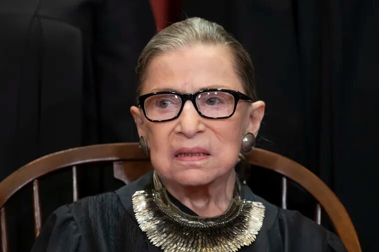 FILE - In this Nov. 30, 2018 file photo, Associate Justice Ruth Bader Ginsburg sits with fellow Supreme Court justices for a group portrait at the Supreme Court Building in Washington. Ginsburg suggested Friday, June 7, 2019, that there will be sharp divisions among her colleagues as they finish their term, with decisions in high-profile cases about the census and the drawing of electoral maps expected before the end of the month.