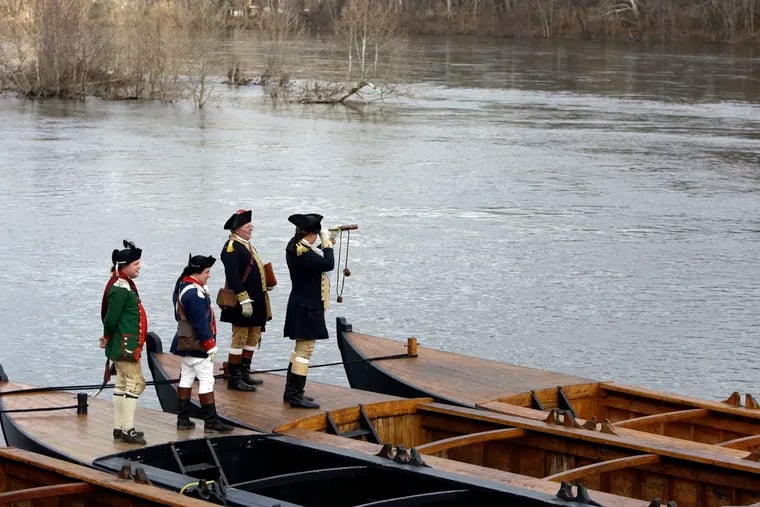 A file photograph shows the 2018 reenactment events around Washington's crossing of the Delaware River. That year, flood waters prevented the boats from attempting it.