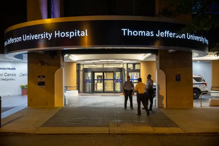Philadelphia police outside Jefferson Hospital early Monday morning. Anrae Thomas, a nursing assistant, was killed by a coworker, and two Philadelphia police officers were shot in a subsequent gun battle with the suspect.
