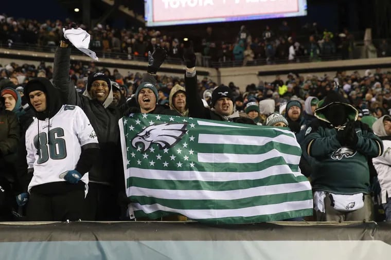 Fans cheer during the Eagles’ 15-10 victory over the Atlanta Falcons in the NFL playoffs on Saturday.