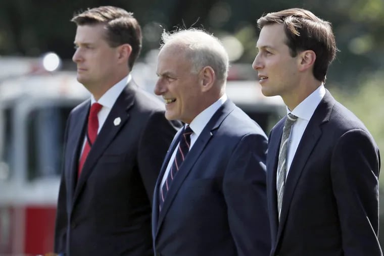 Ousted White House Staff Secretary Rob Porter, Chief of Staff John Kelly, and senior adviser Jared Kushner walk to Marine One on the South Lawn of the White House in happier times.