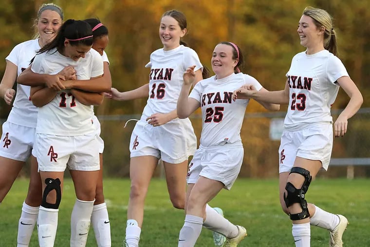 Archbishop Ryan players from Right #23 Brooke Kelly, #25 Cecilia DuMond, #16 Shauna Breen are running over to #17 Jules Blank for celebration after winning 3-0 over Lansdale Catholic. (AKIRA SUWA / For The Inquirer)