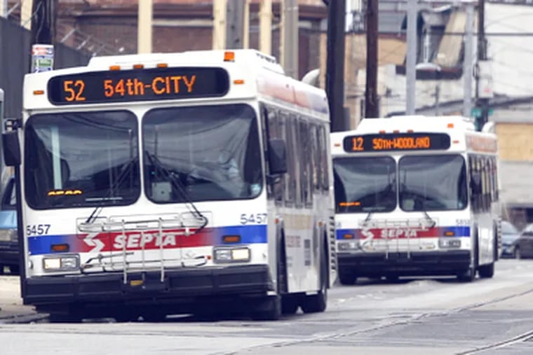 SEPTA buses along Woodland Avenue. Getting up-to-the-minute information on a smartphone about current bus schedules is one type of valuable data. (Yong Kim / Staff Photographer)