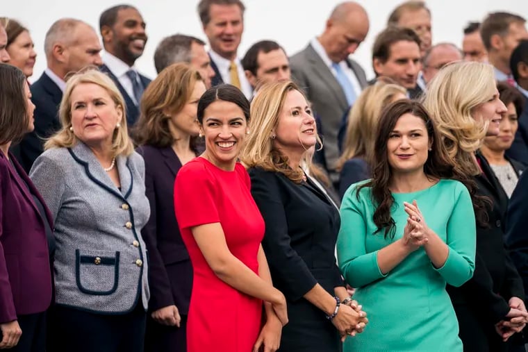 Newly elected members of Congress (from left) Sylvia Garcia (D-Texas), Alexandria Ocasio-Cortez (D-N.Y.), Debbie Mucarsel-Powell (D-Fla.), and Abby Finkenauer (D-Iowa) at a class photo in November.