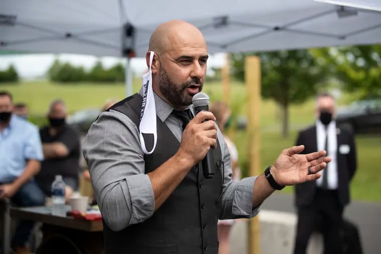 Rui Lucas, general manager of operations for naBrasa and Iron Abbey, speaks to restaurant owners about COVID-19 restrictions outside of Iron Abbey in Horsham on Thursday, July 16, 2020.
