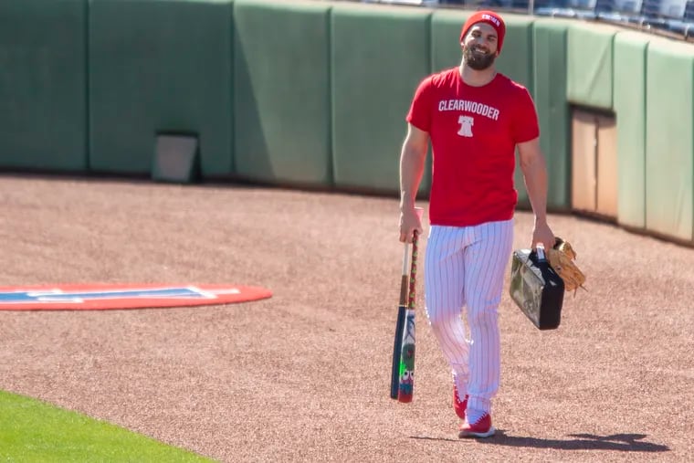Phanatic bat in hand, Phillies star right fielder Bryce Harper arrived Tuesday for his first spring-training workout.