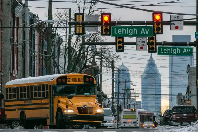 School bus with the Philadelphia skyline as seen from North 17th Street just above Lehigh Avenue on Friday morning, Dec. 18, 2020.