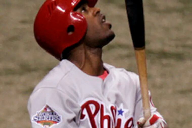 Jimmy Rollins pops up to open Game 2. He is hitting .191, with two homers and two RBIs, in the playoffs.