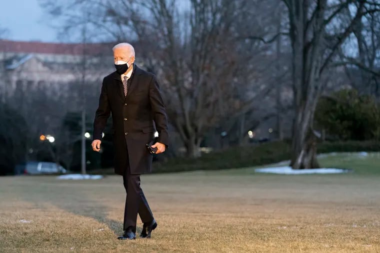 President Joe Biden walks on the South Lawn of the White House after stepping off Marine One on Friday in Washington.