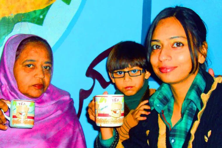 Having tea at a restaurant are the author, Sahar Majid (right), who has taken to wearing Western attire, her older niece, and her mother, Abida Kausar