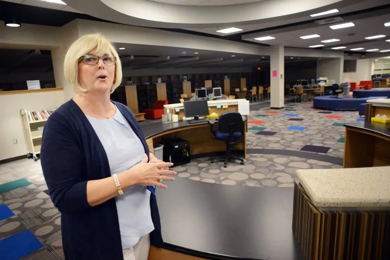 Kathleen Leon, assistant to the superintendent, shows the new media center during a tour of Bensalem High School.