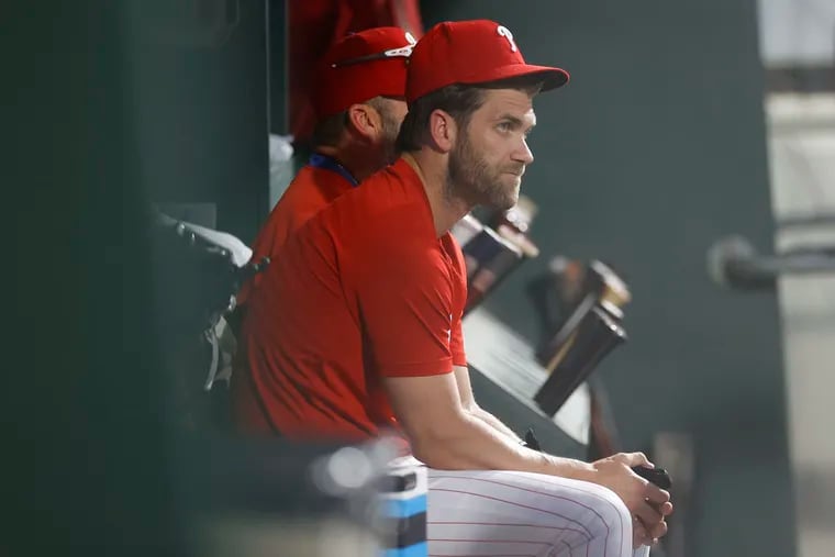 Bryce Harper is focused on regaining his swing more than his throwing arm as he works his way back from injury.
