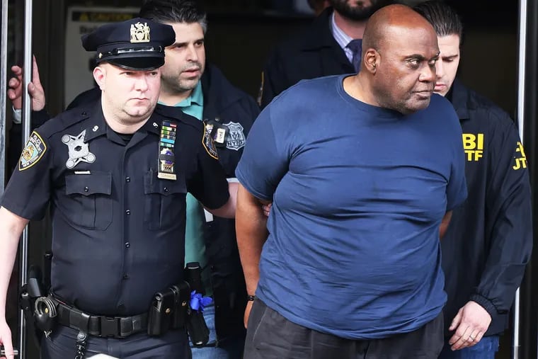 Suspect Frank James is led by police from Ninth Precinct after being arrested for his connection to the mass shooting at the 36th Street subway station in New York City.
