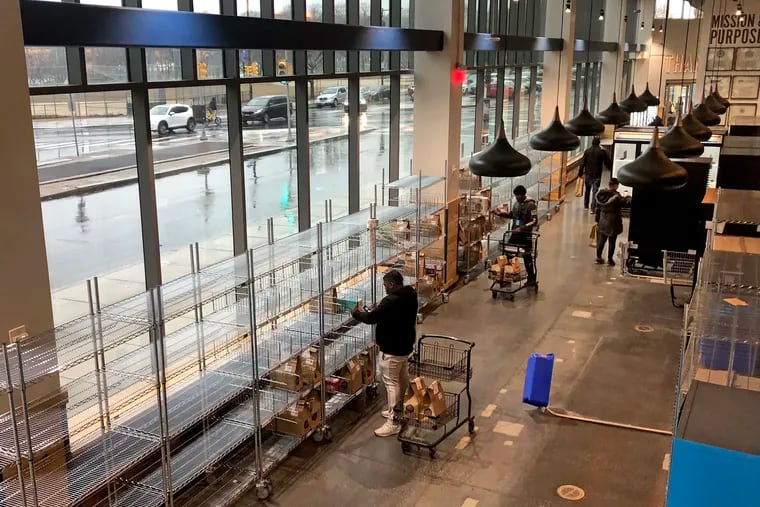 Whole Foods just ripped out the ground-floor cafe at its Fairmount store and installed refrigerators and lockers for the delivery and pickup trade. When the store opened, its cafe was hailed as one of its best features.