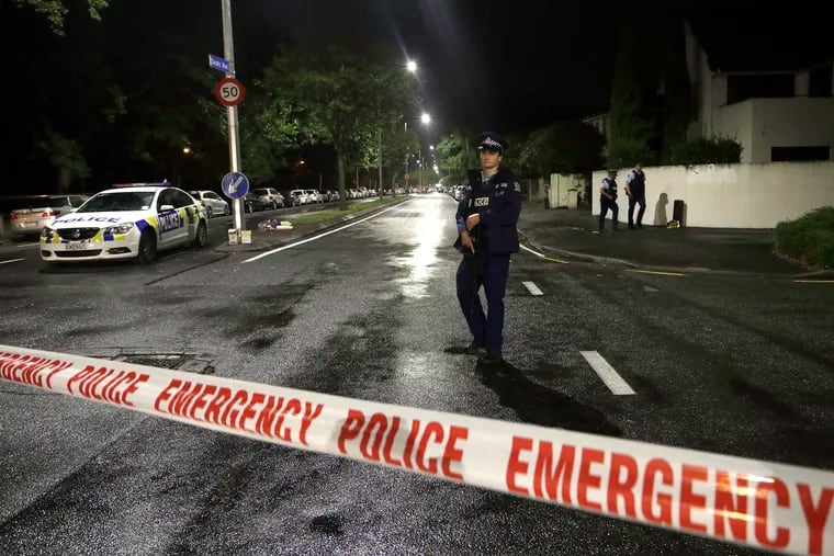 A police officer patrols at a cordon near a mosque in central Christchurch, New Zealand, on Friday after multiple people were killed in mass shootings at two mosques there.