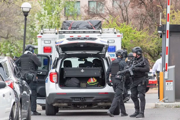 A S.W.A.T team prepares during a barricade situation in connection with the abduction of a toddler at a hotel near the Philadelphia International Airport on April 12.