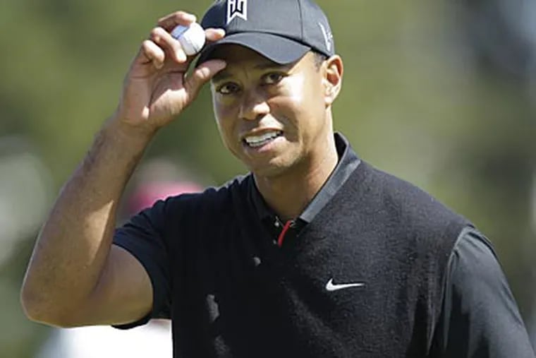 Tiger Woods reacts after making a birdie on the 10th hole during the
second round of the U.S. Open. (Ben Margot/AP)