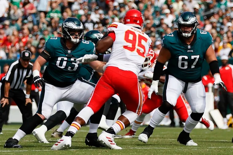 Eagles offensive tackle Jack Driscoll (left) and guard Nate Herbig shut out Chiefs defensive end Chris Jones on Sunday as the makeshift offensive line shined.