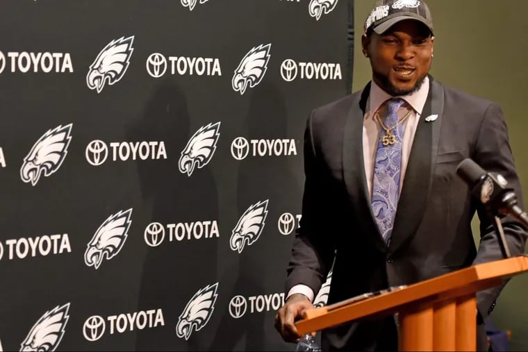 Eagles linebacker Nigel Bradham arrives at the podium to talk to the media March 15, 2018 after the team re-signed him following their restructuring of Zach Ertz's contract, during free agency week. TOM GRALISH / Staff Photographer