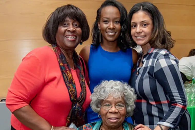 Ivy Maina (center) poses with Dr. Bennett (front); and Erika Dawson, Associate Director of the Program for Diversity and Inclusion (right) at a recent event.