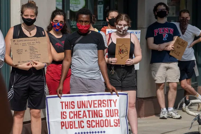 Penn students, faculty, staff, and community members rally during a protest on the 36th block of Walnut Street in Philadelphia, Friday, July 31, 2020. Protest rally to demand PILOTs from David Cohen.