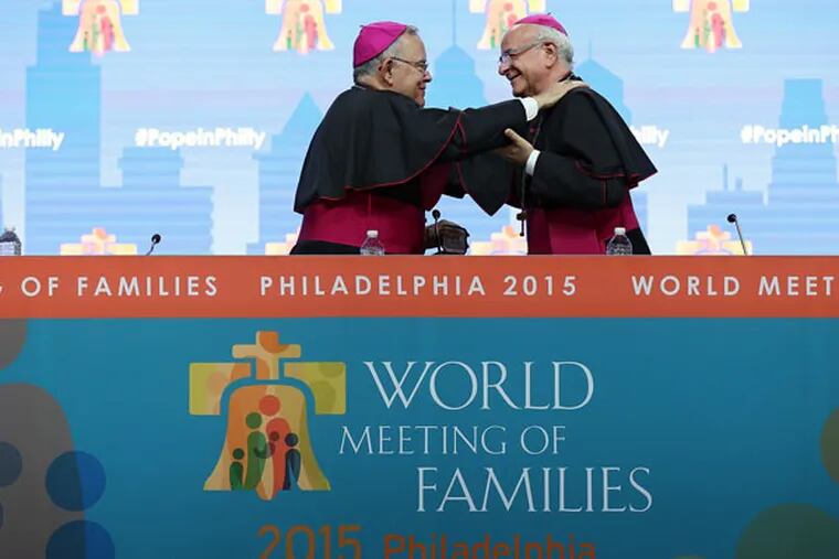 Archbishops Carles Chaput (left) and Vincenzo Paglia at the World Meeting opening ceremonies. (DAVID MAIALETTI/STAFF PHOTOGRAPHER)