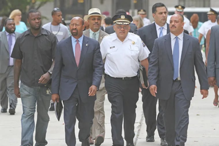 District Attorney Seth Williams (right), Police Commissioner Charles H. Ramsey, and Mayor Nutter walk toward Nutter's news conference in Dilworth Plaza, joined by supporters. (Michael Bryant / Staff Photographer)
