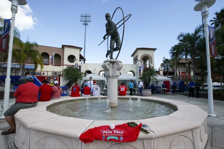 Fans wait outside Spectrum Field in Clearwater, Fla., before the start of the celebration of life for Roy Halladay.