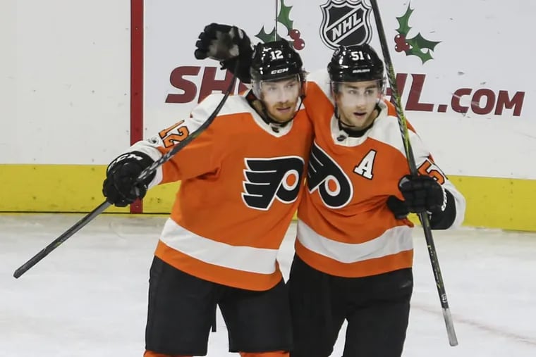 Flyers’ center Valtteri Filppula, right, celebrates with Michael Raffl his goal against the Sabres during the second period at the Wells Fargo Center in Philadelphia, Thursday, December 14, 2017.