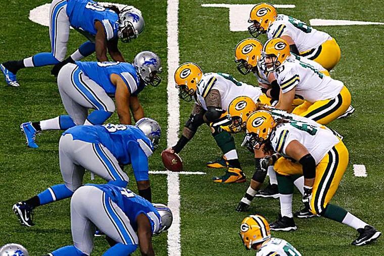 Packers quarterback Matt Flynn lines up against the Lions. (Paul Sancya/AP)
