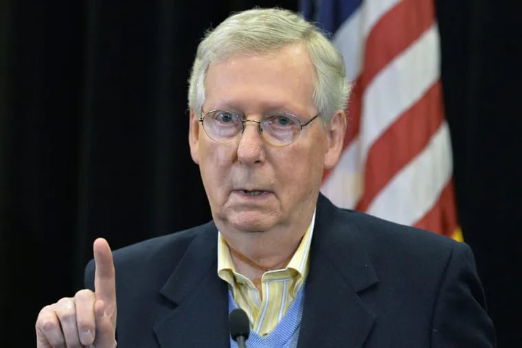 Senate Majority Leader Mitch McConnell, R-Ky., answers a reporters question during a news conference Saturday, Dec. 2, 2017, in Louisville, Ky. The Senate passed the tax bill early Saturday morning with a 51-49 vote. (AP Photo/Timothy D. Easley)